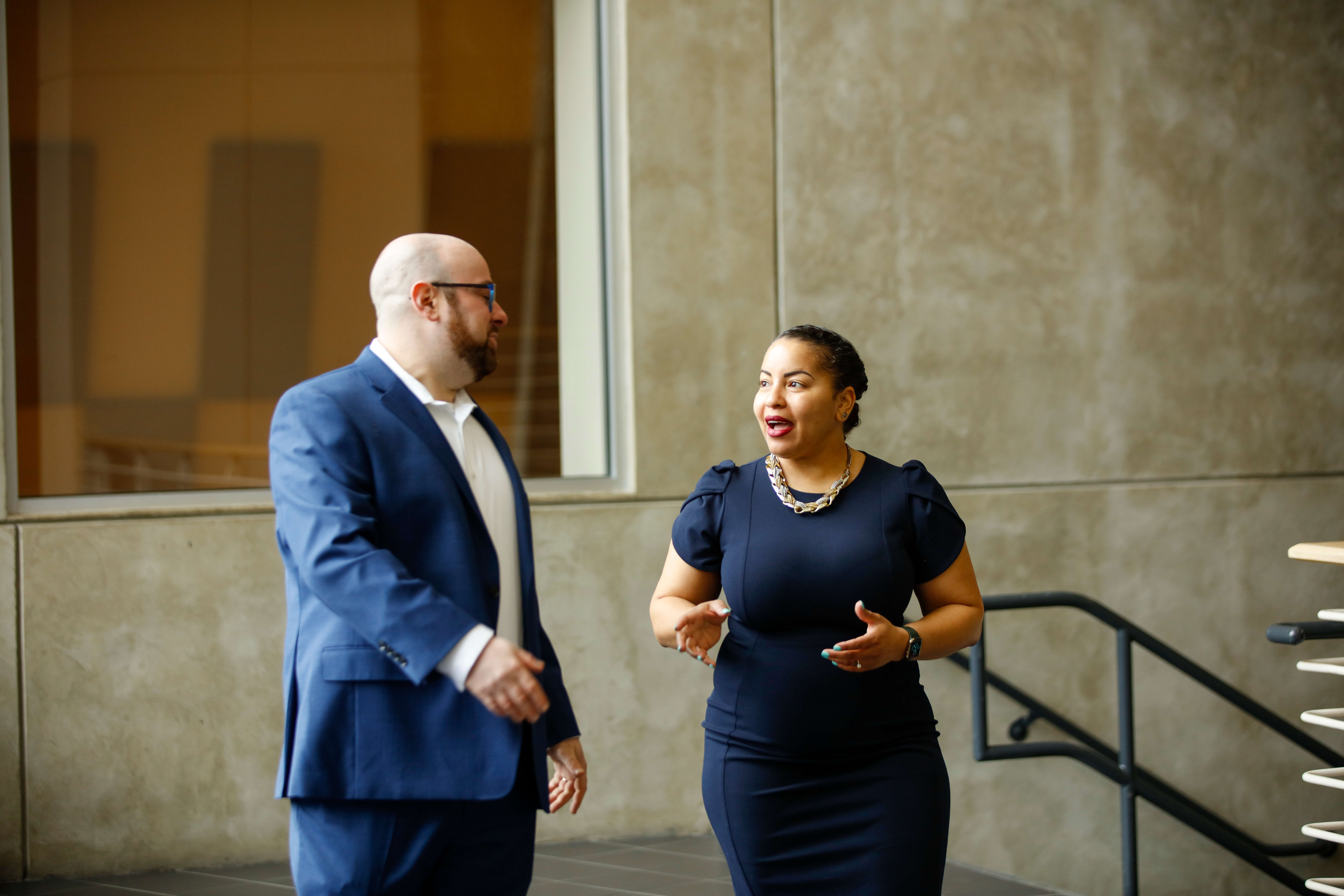 An adult student discussing homework with another student