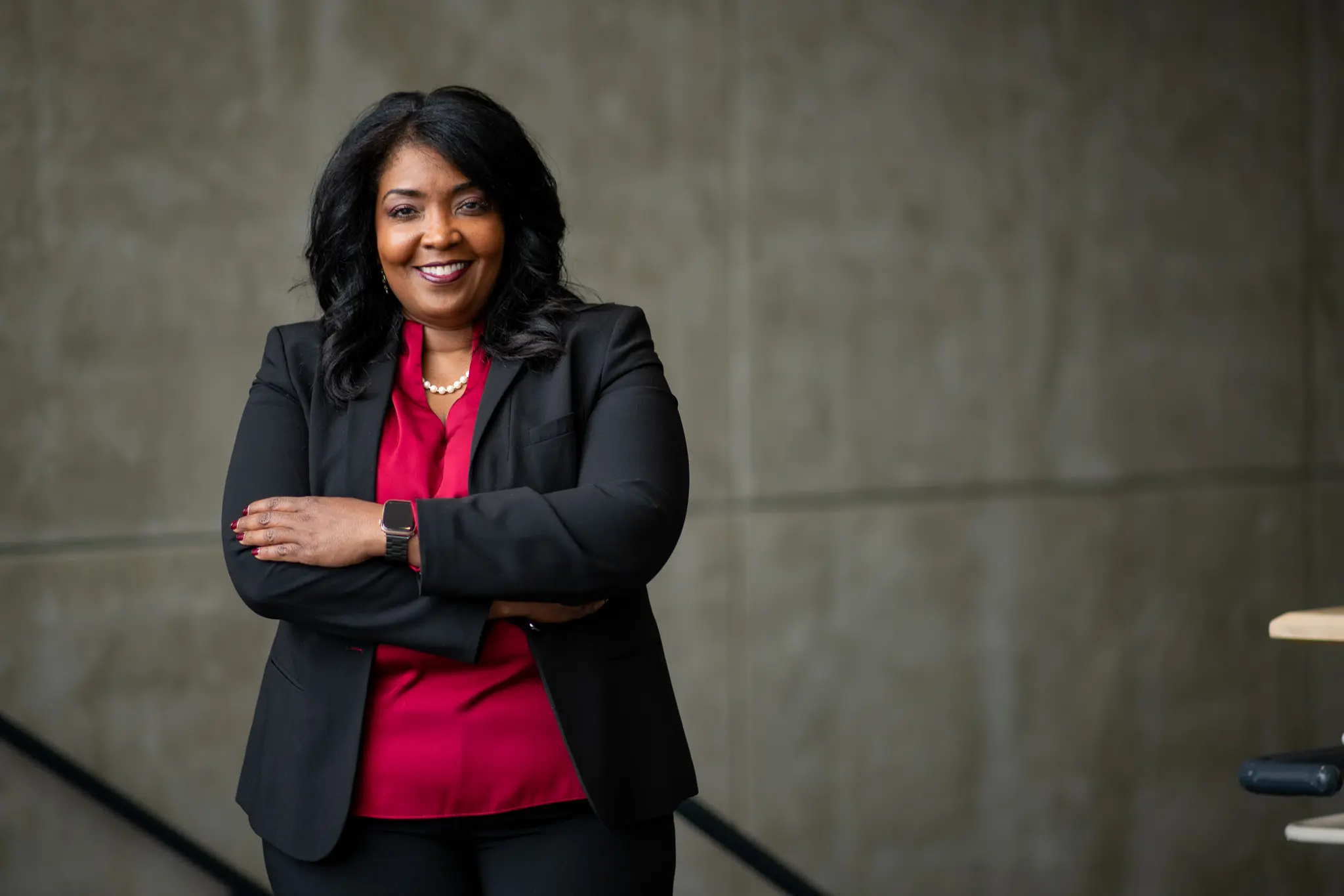 A confident business student smiles